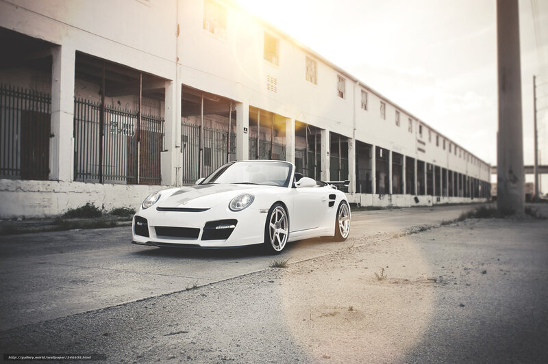 White Porsche in industrial setting