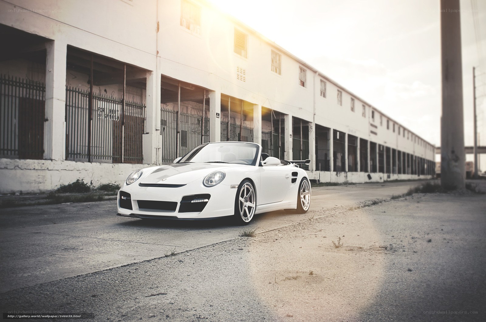 White Porsche in industrial setting