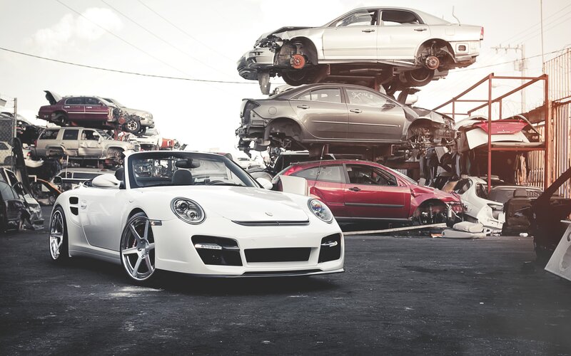 White Porsche in junkyard