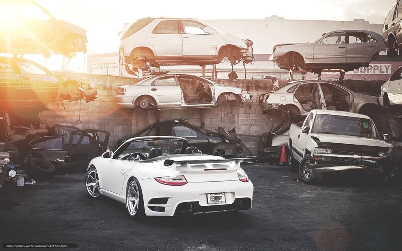 White Porsche in junkyard
