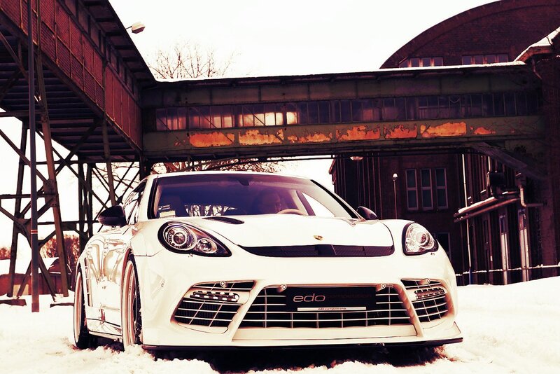 White Porsche in snowy industrial setting
