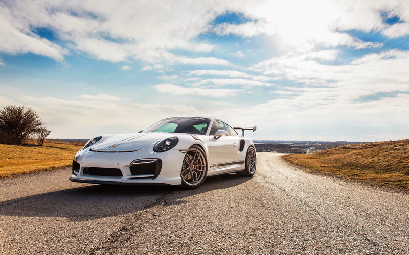 White Porsche on a country road