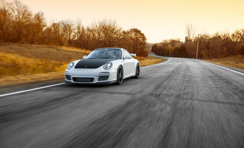 White Porsche on a country road
