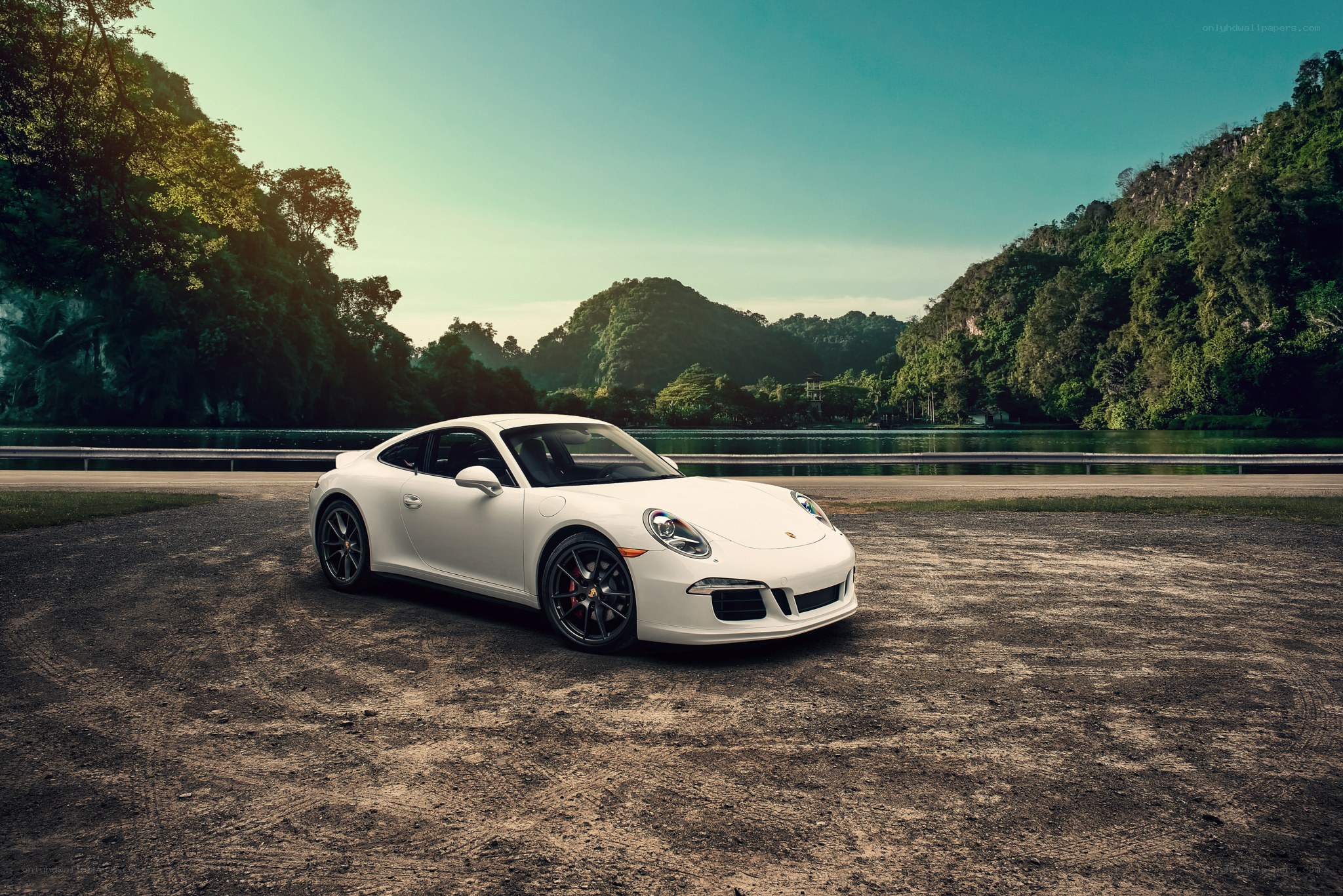 White Porsche on a dirt road