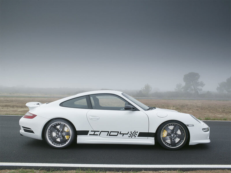 White Porsche on a foggy track