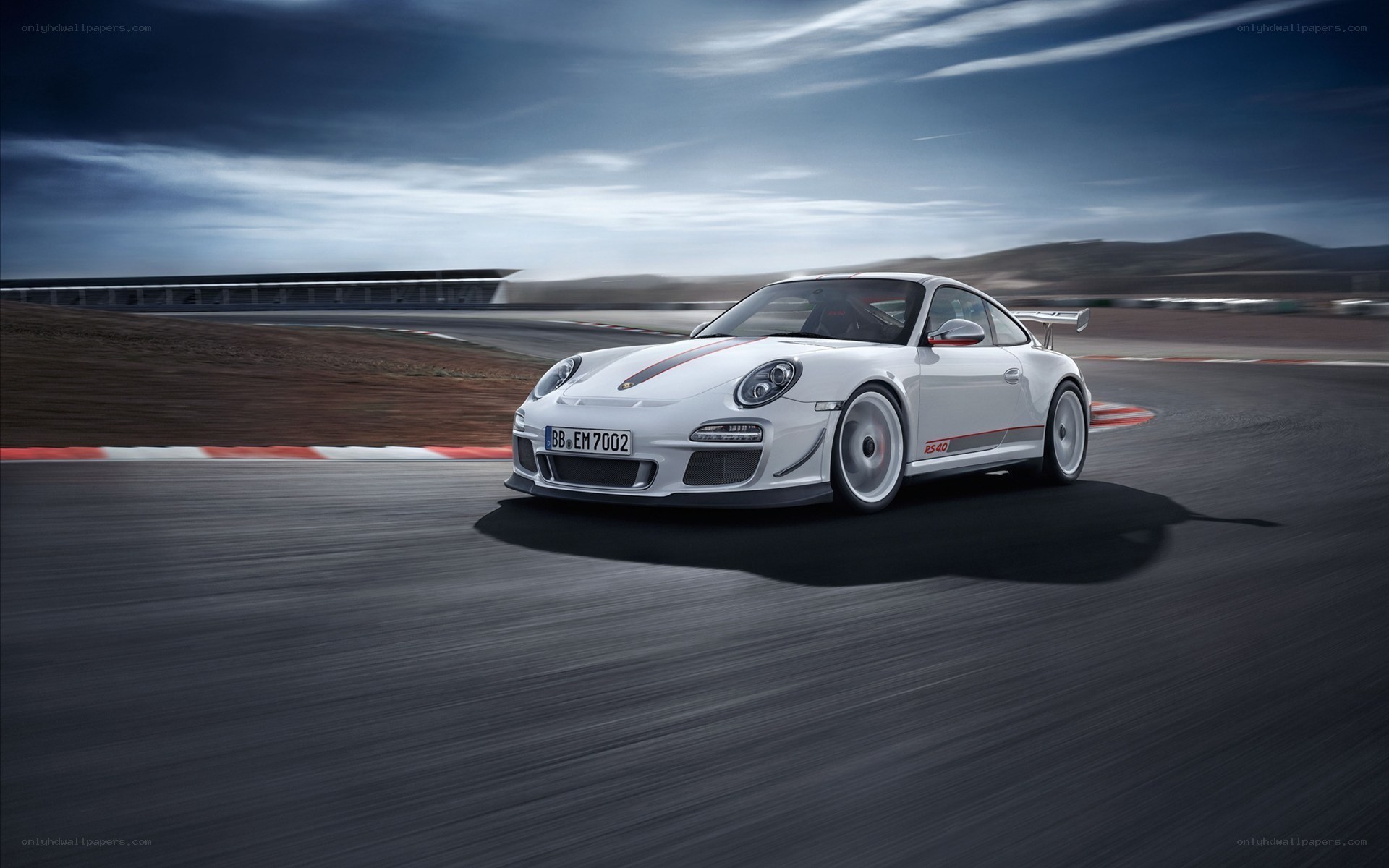 White Porsche on a racetrack
