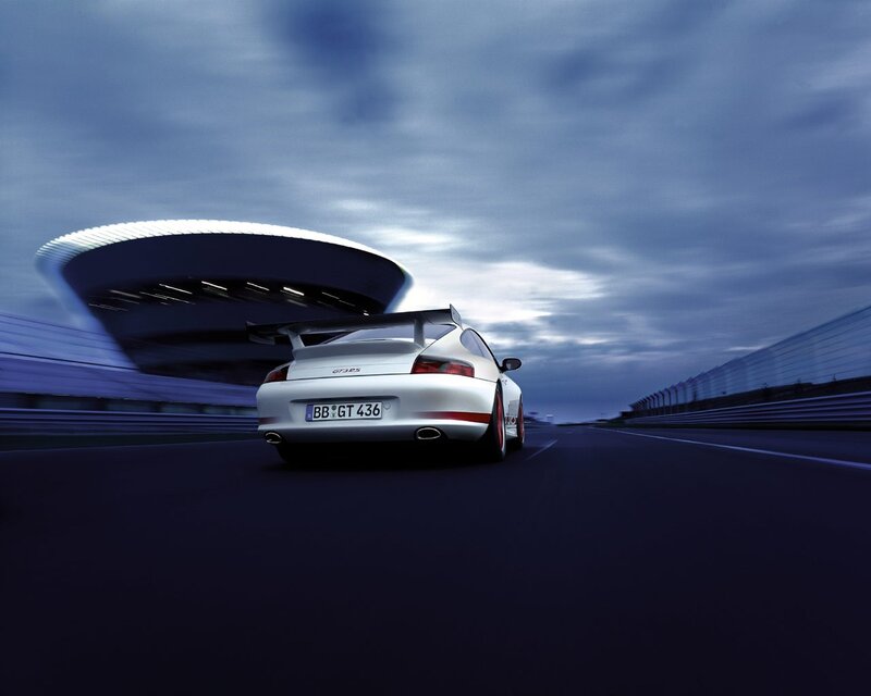 White Porsche on a racetrack