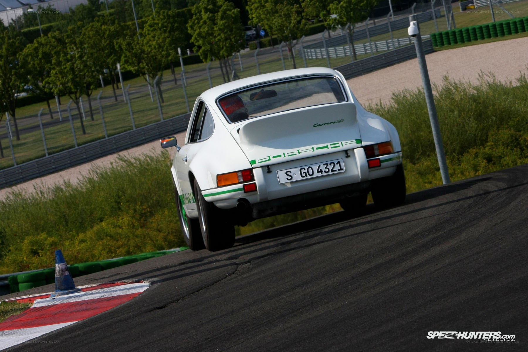 White Porsche on a racetrack