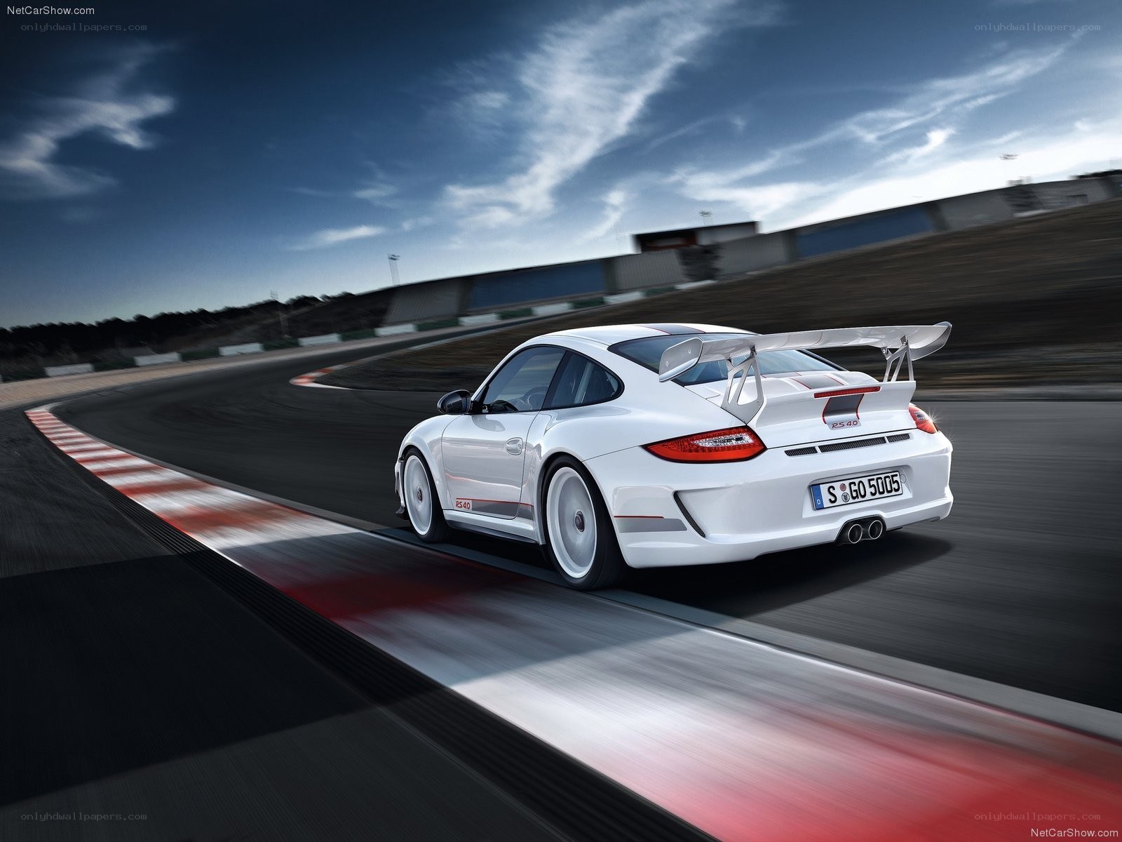 White Porsche on a racetrack
