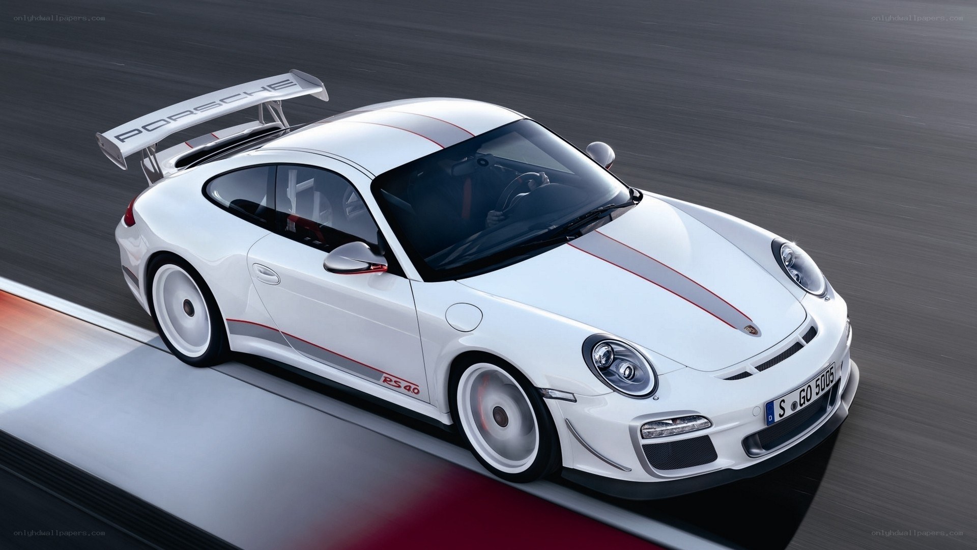 White Porsche on a racetrack