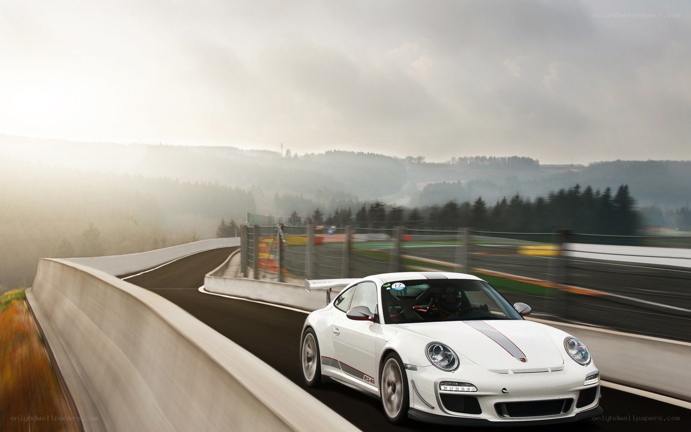 White Porsche on a racetrack