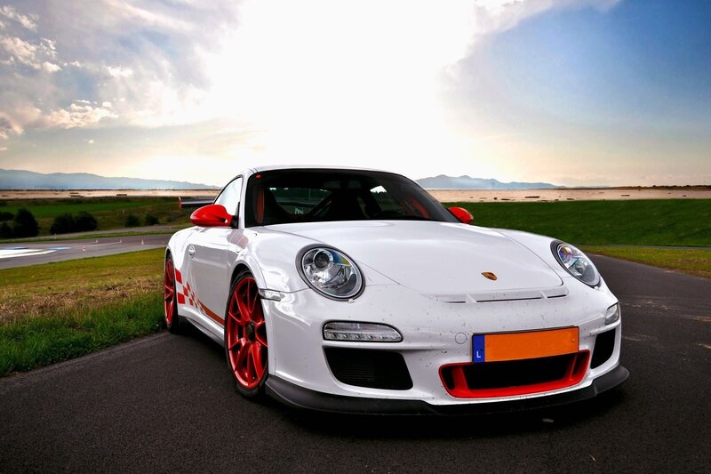White Porsche on a racetrack