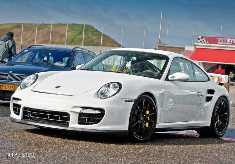 White Porsche on a racetrack