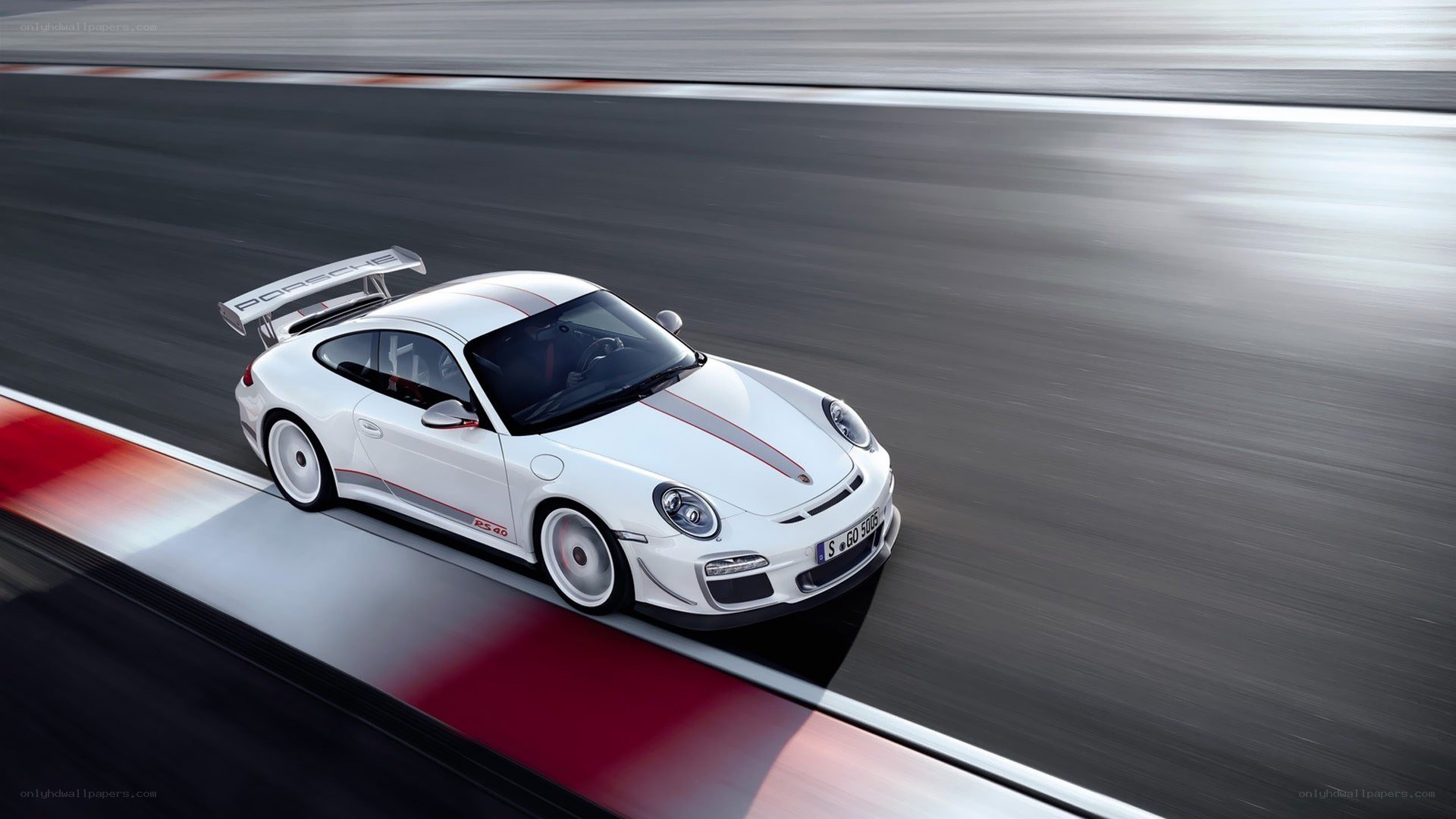 White Porsche on a racetrack