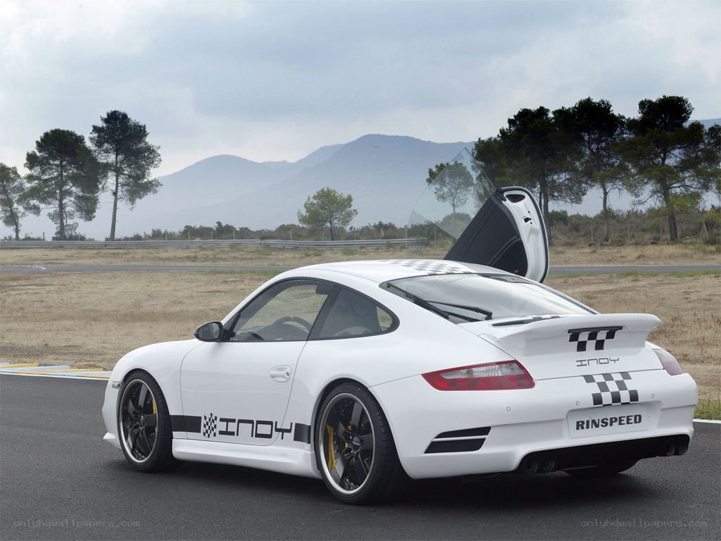White Porsche on a racetrack