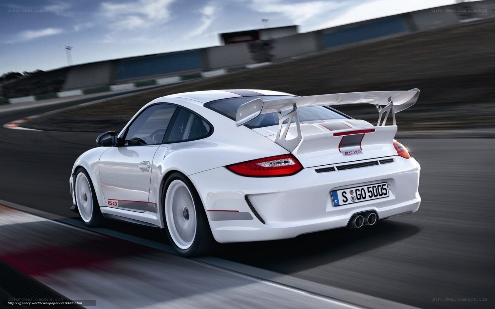 White Porsche on a racetrack