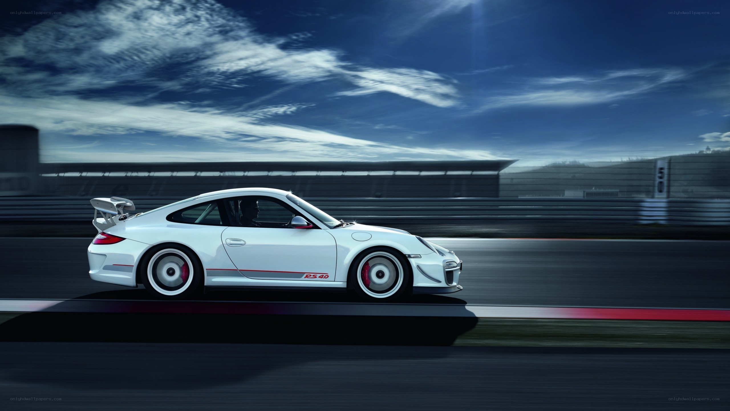 White Porsche on a racetrack