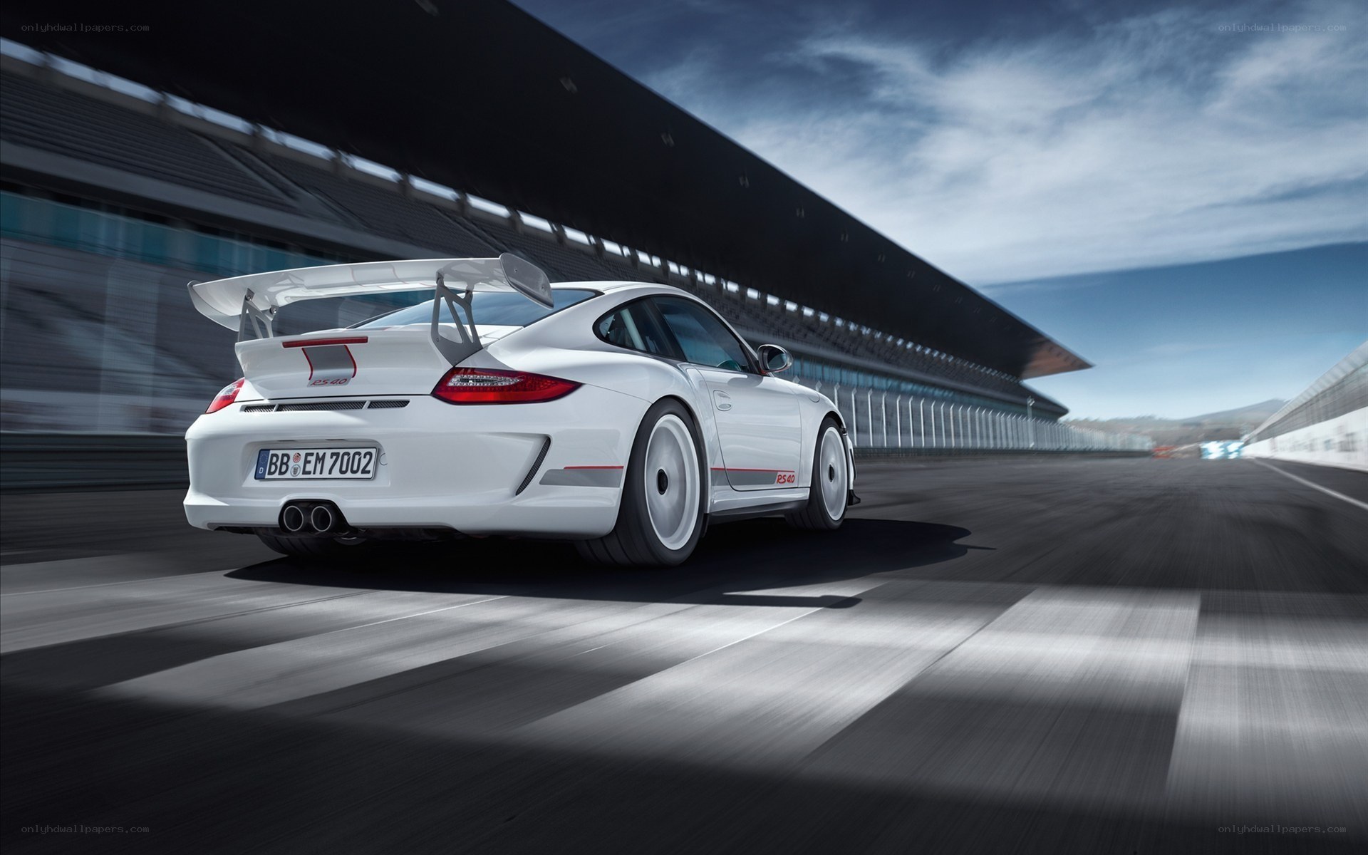 White Porsche on a racetrack