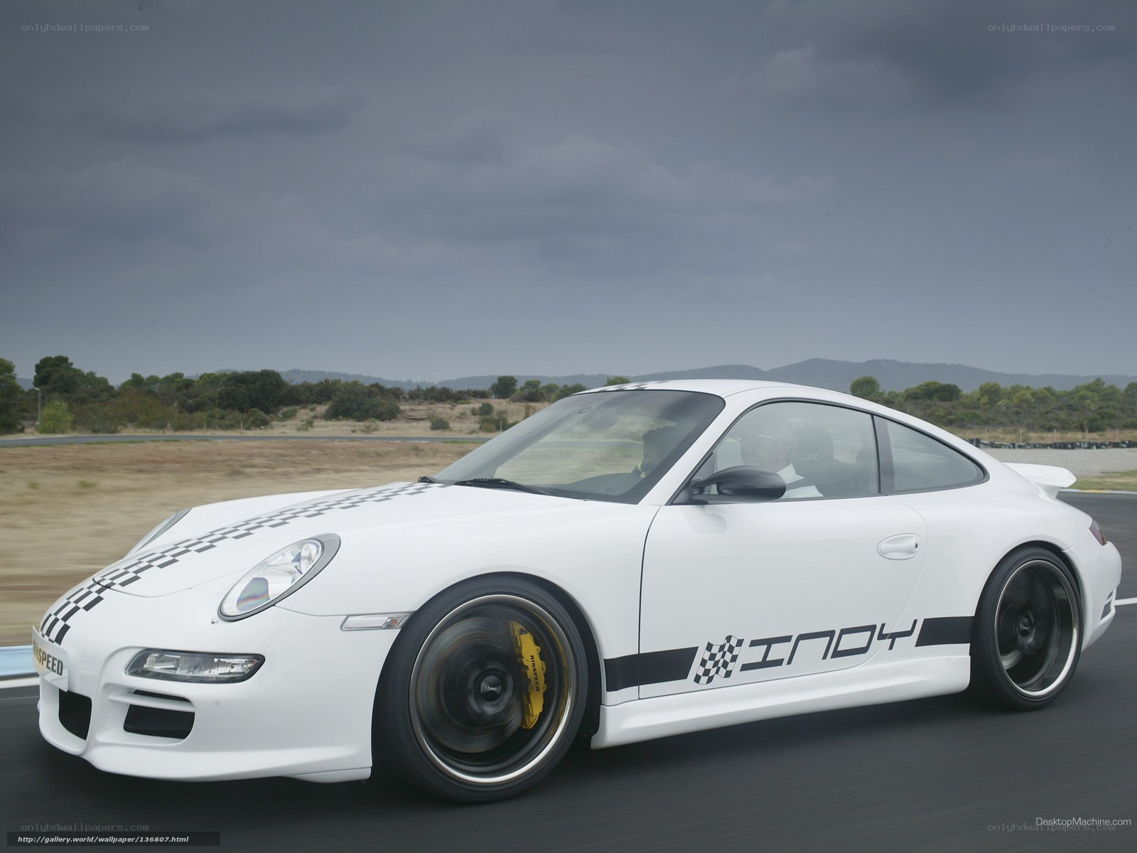 White Porsche on a racetrack