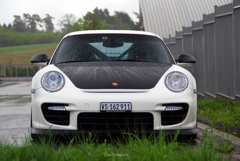 White Porsche on a rainy day