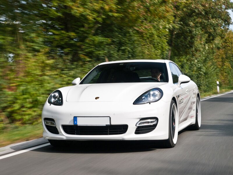 white porsche on a road