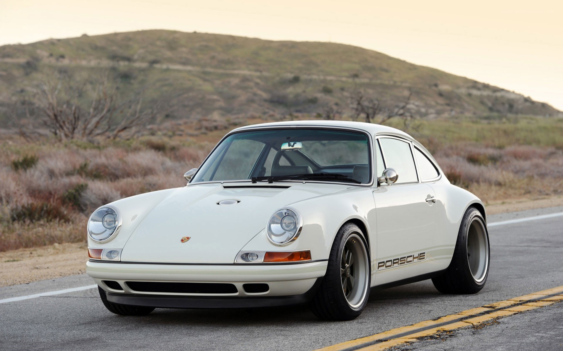 white porsche on a road