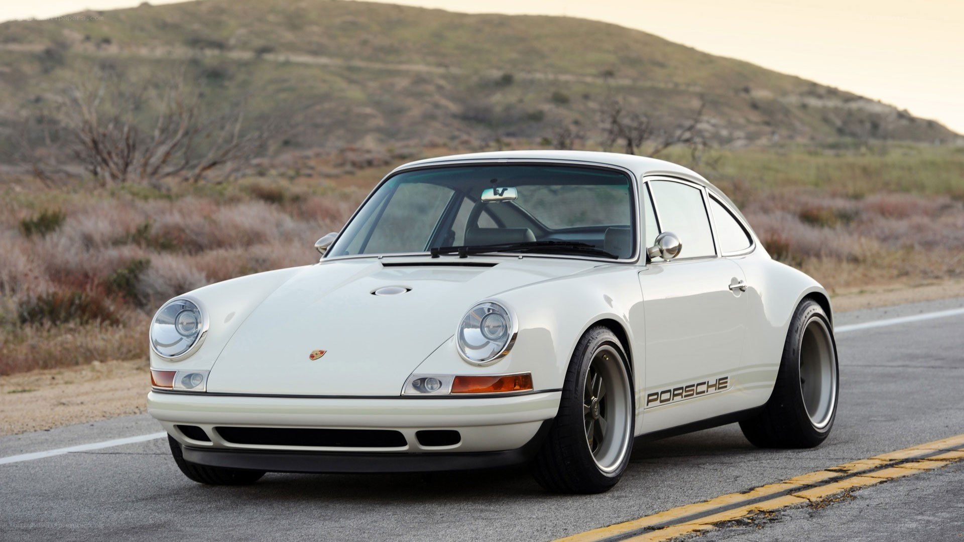 white porsche on a road