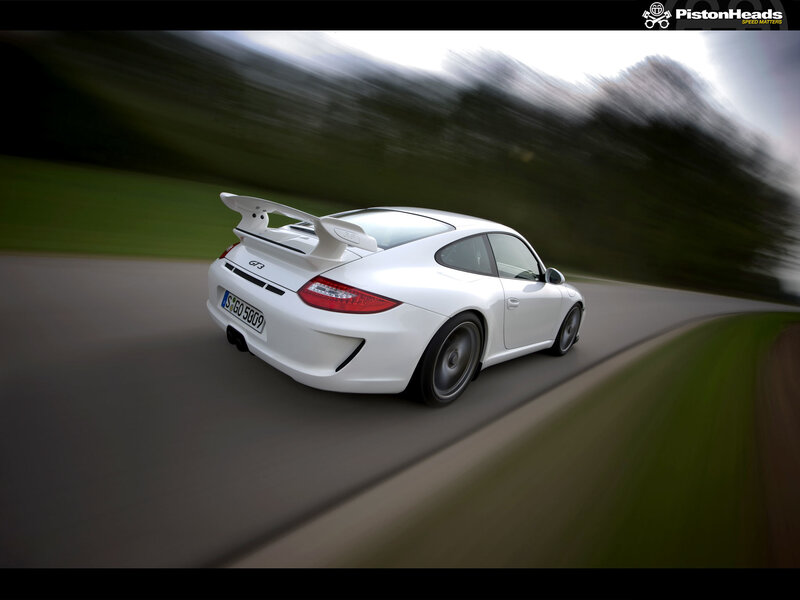 white porsche on a road