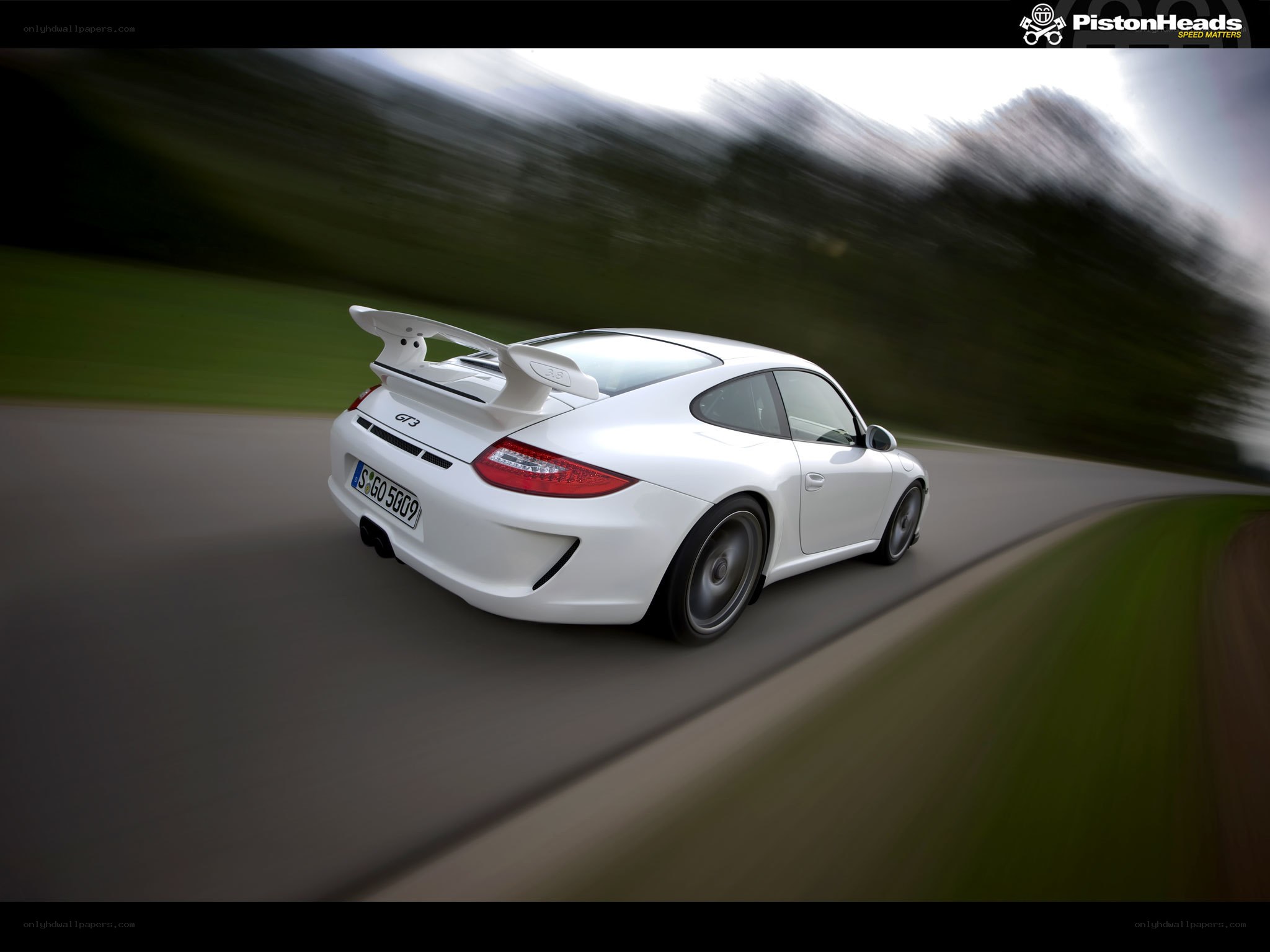 white porsche on a road