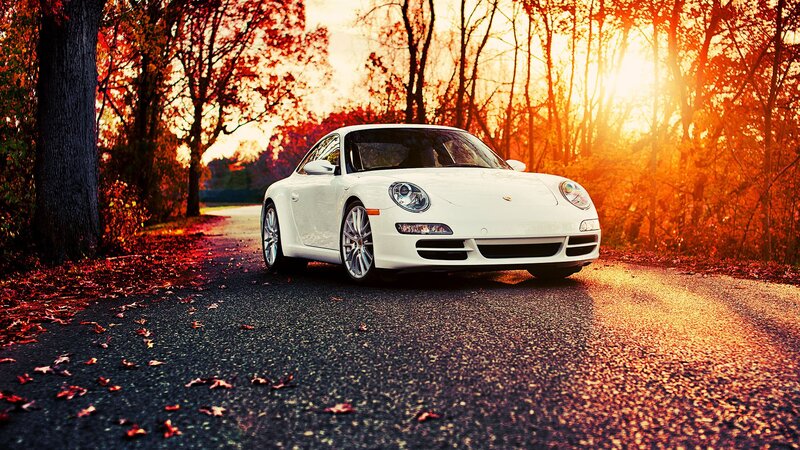 White Porsche on autumn road