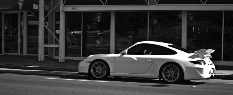 White Porsche on city street