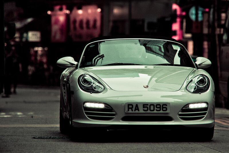 white porsche on city street