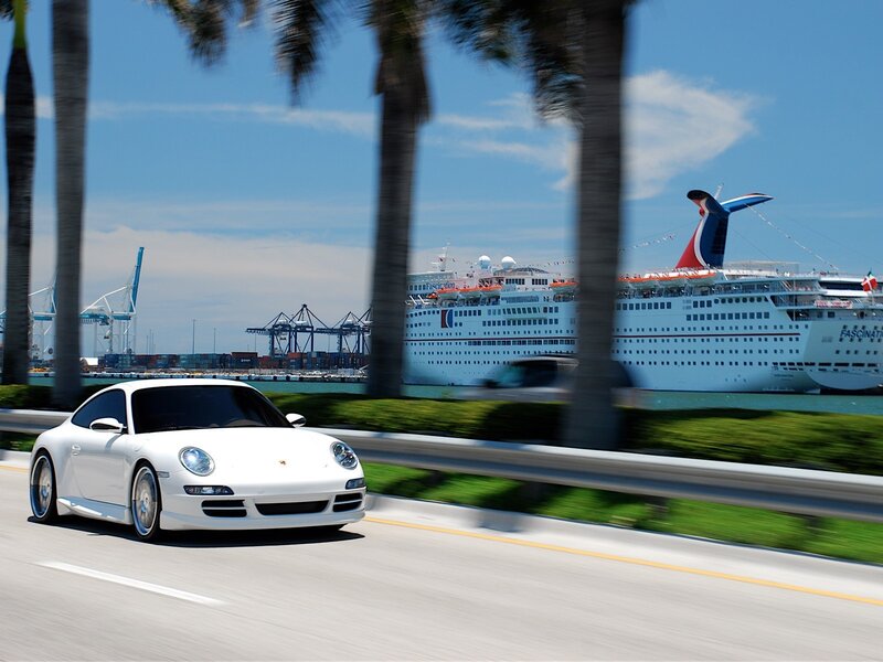 White Porsche on coastal road