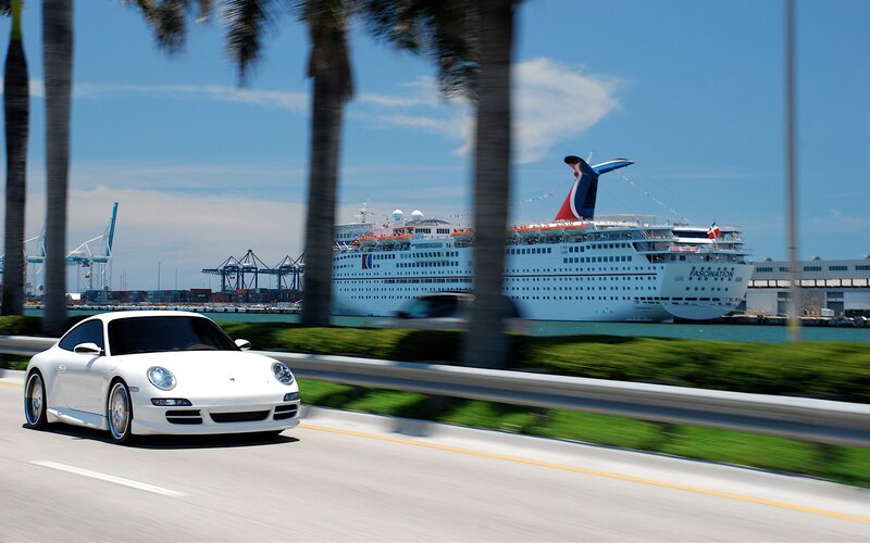 White Porsche on coastal road
