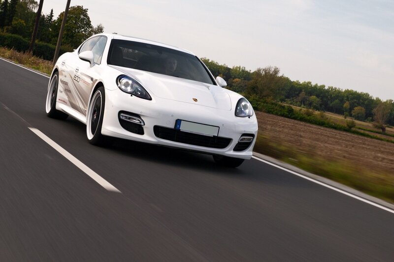 white porsche on country road