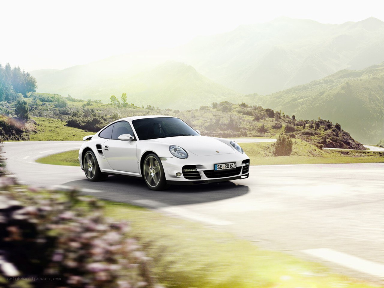 White Porsche on mountain road