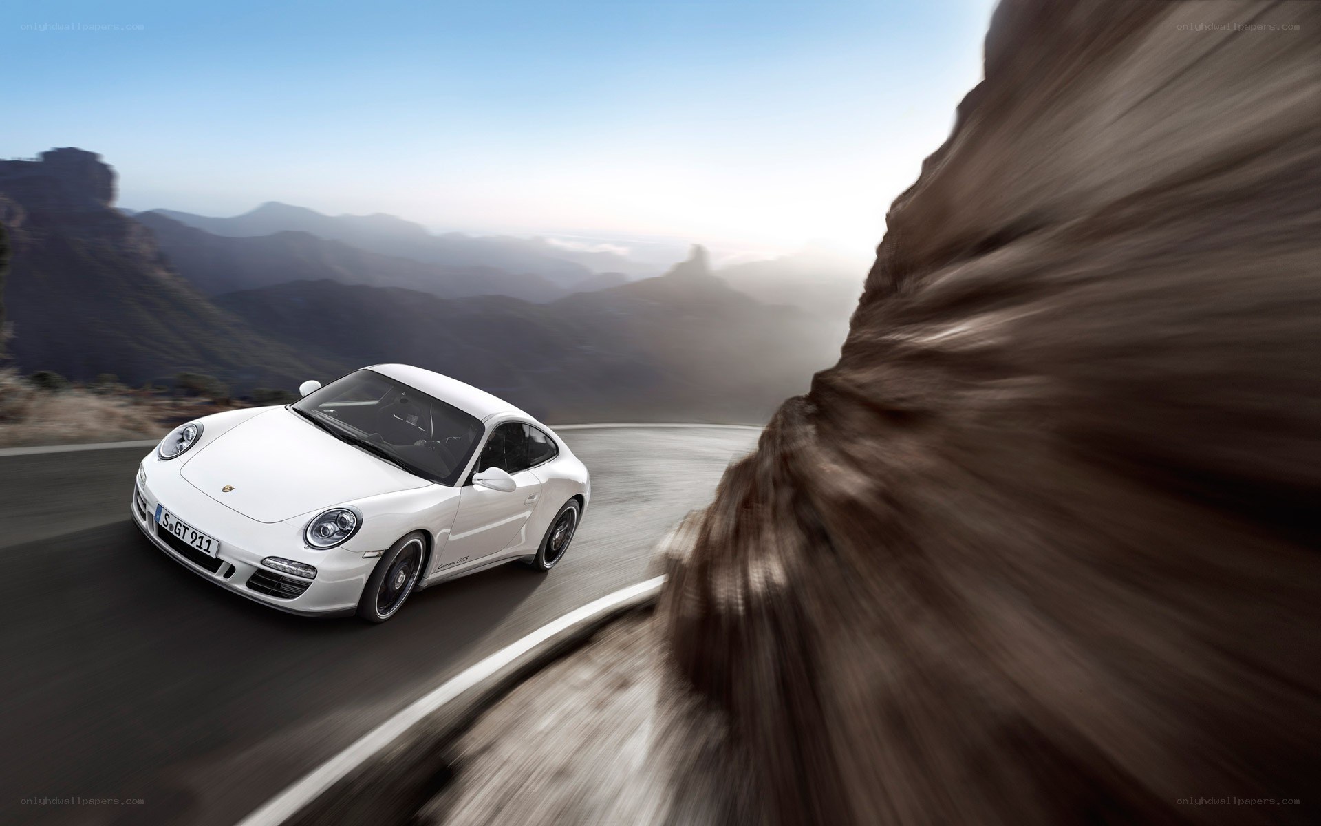 White Porsche on mountain road
