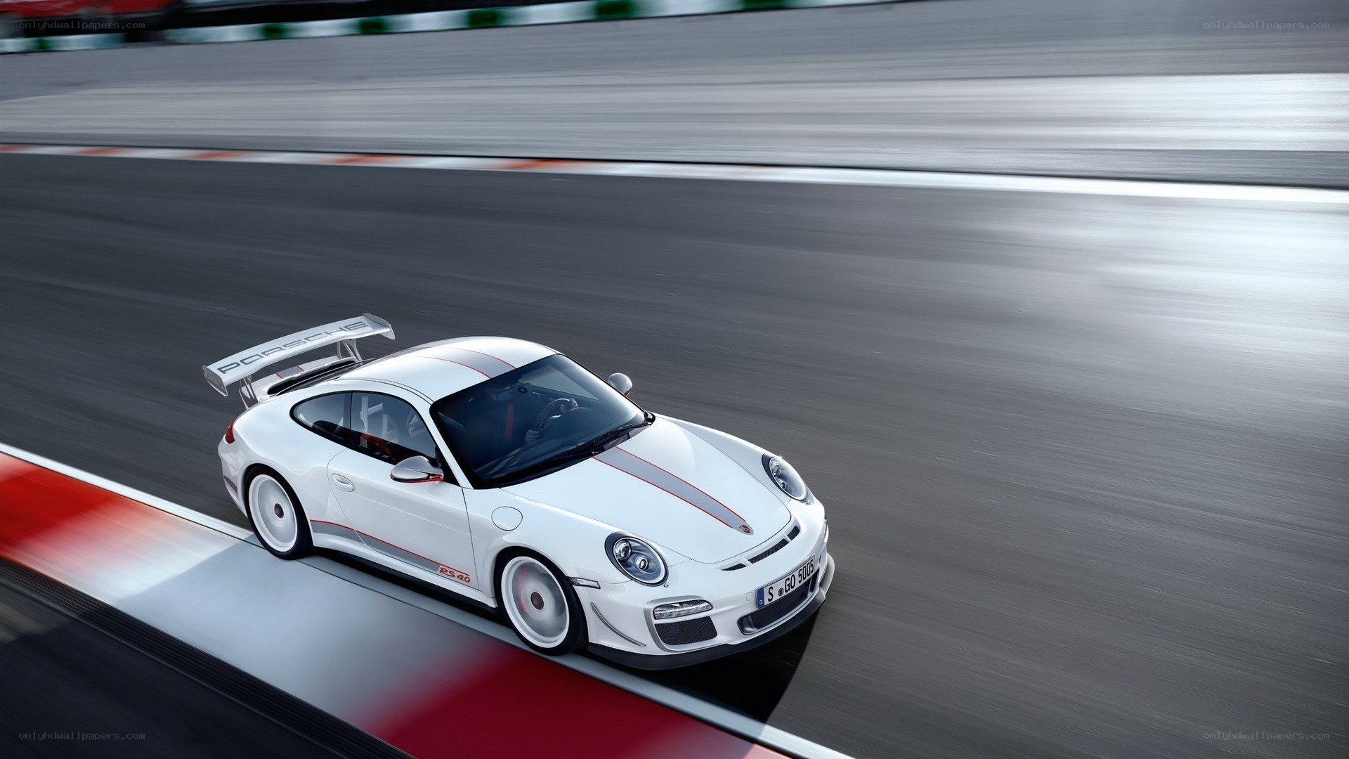 white porsche on racetrack