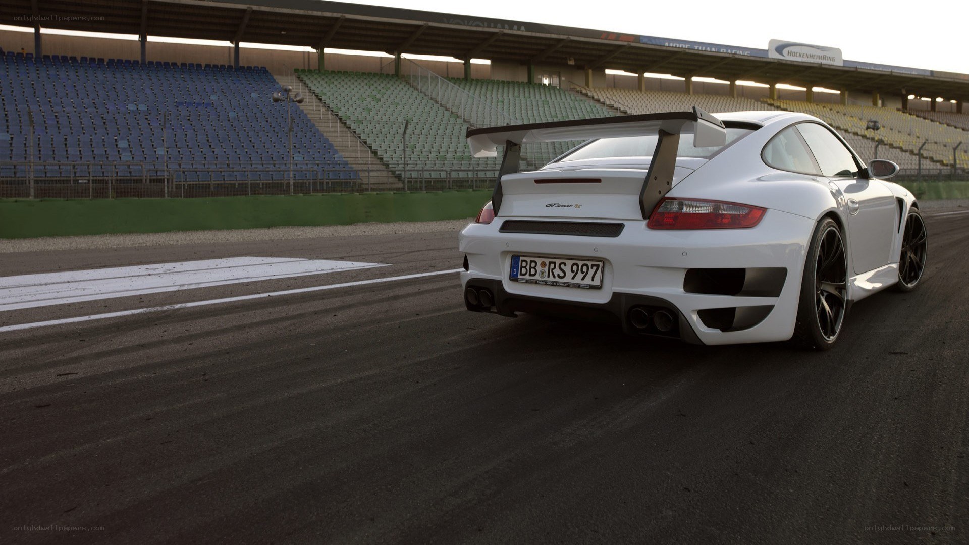 white porsche on racetrack