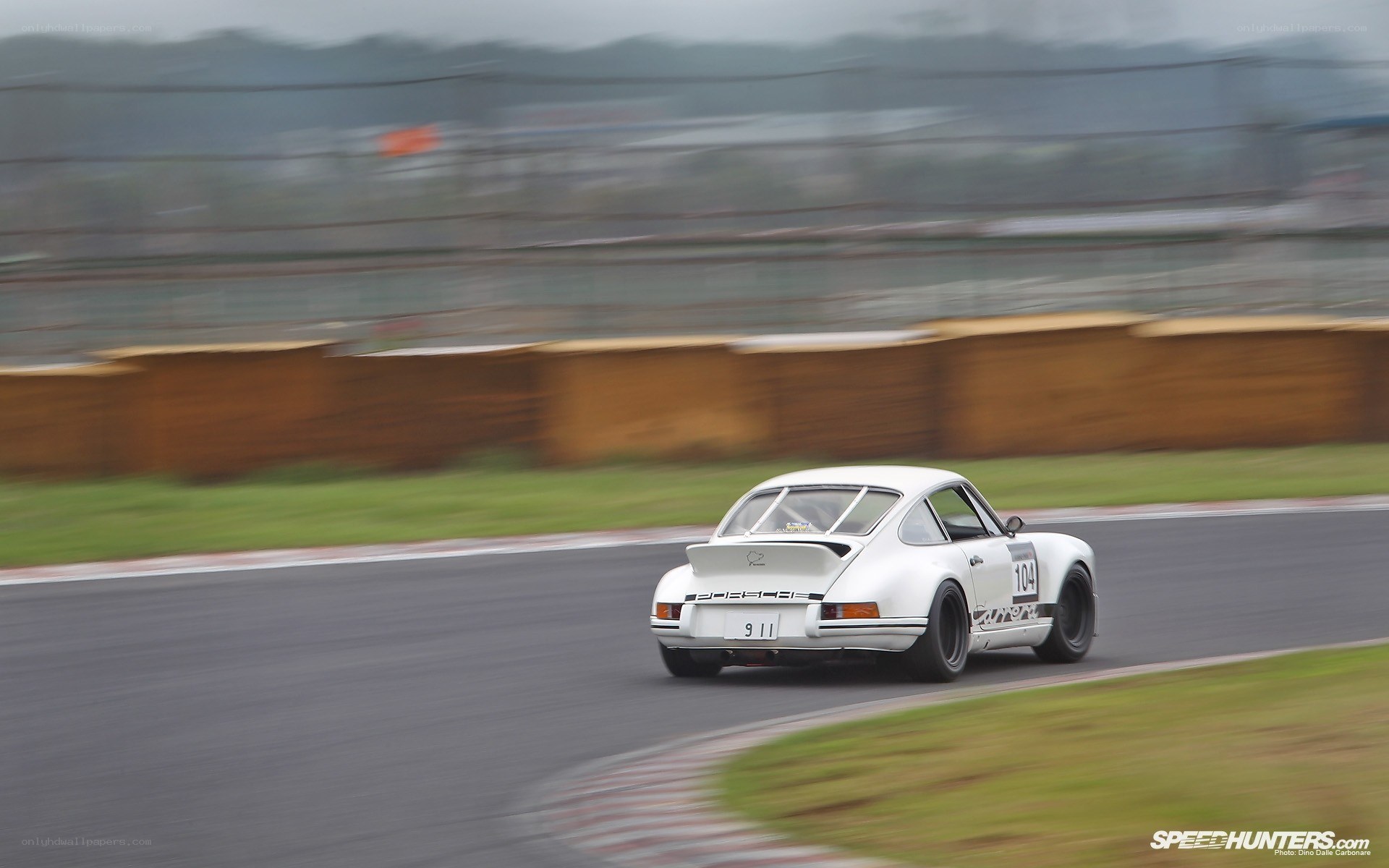 white porsche on racetrack