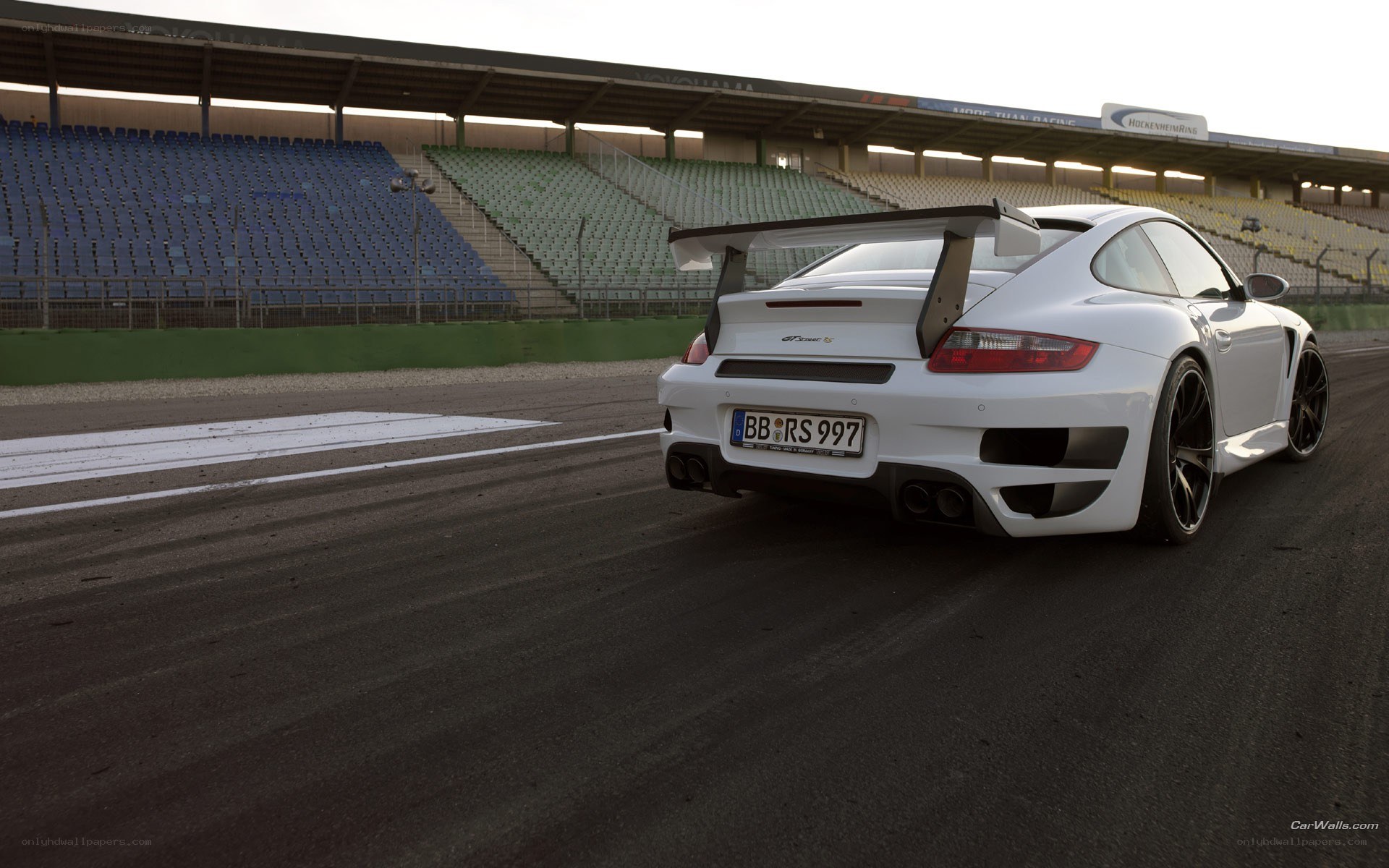 white porsche on racetrack
