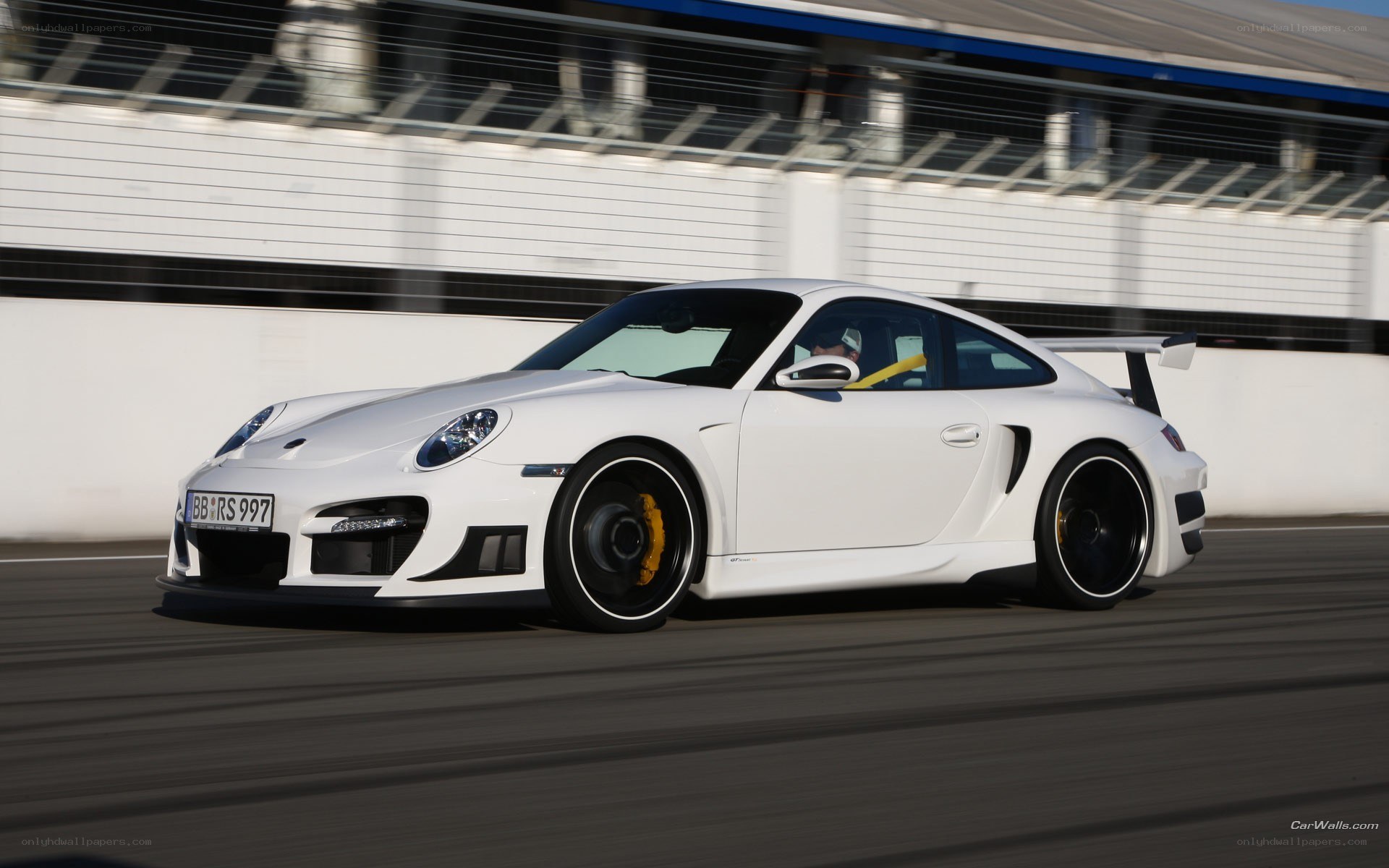 white porsche on racetrack