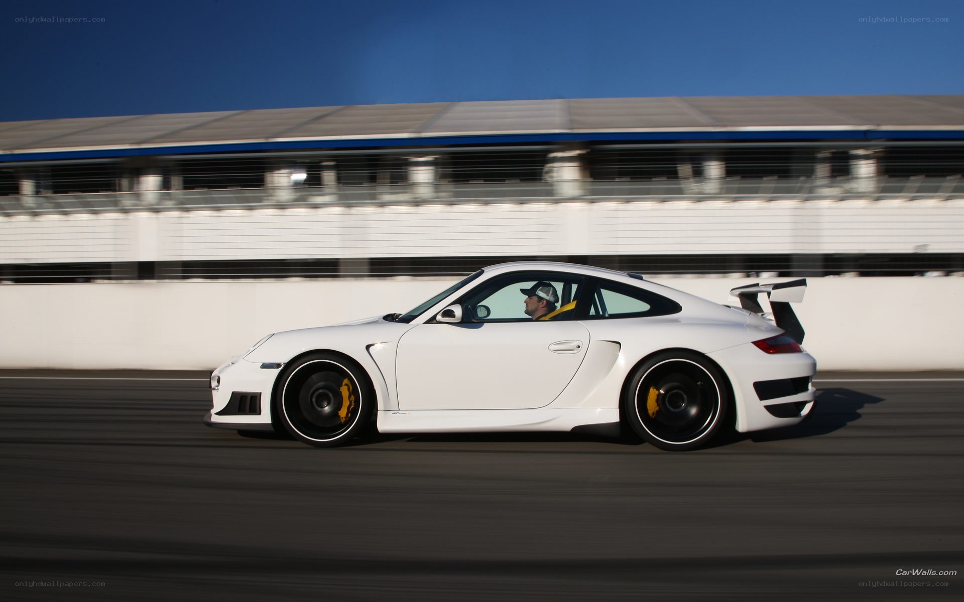 white porsche on racetrack