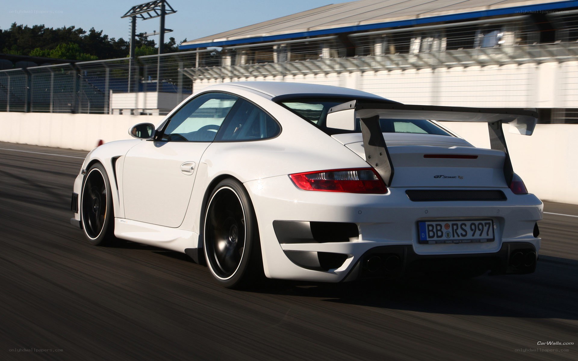 white porsche on racetrack