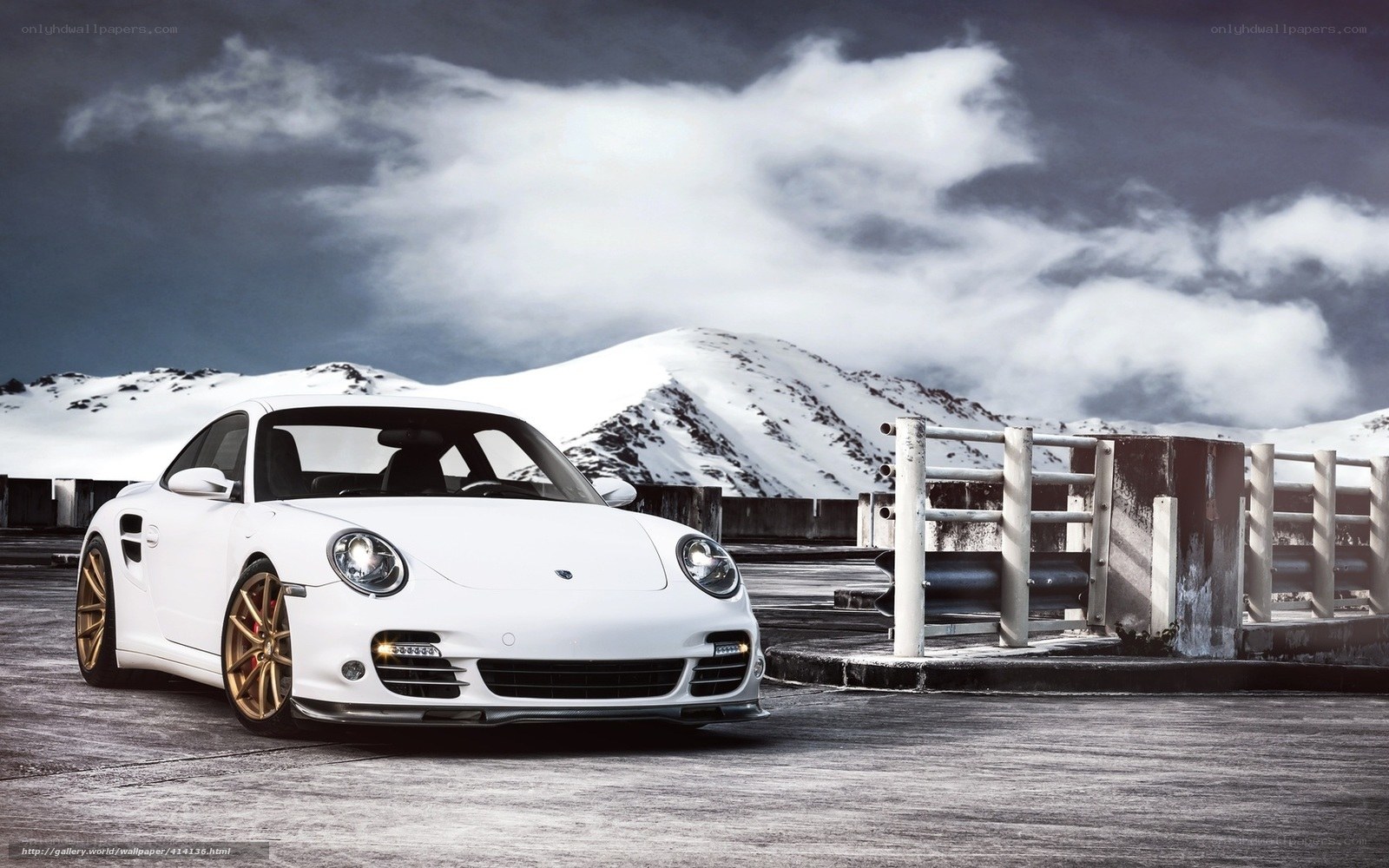 White Porsche on snowy mountain