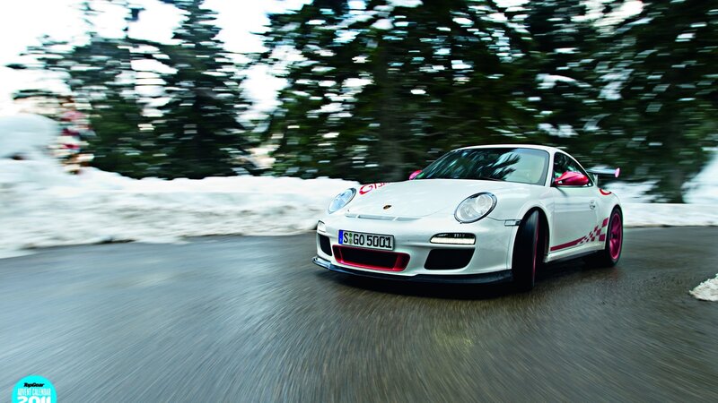 white porsche on snowy road