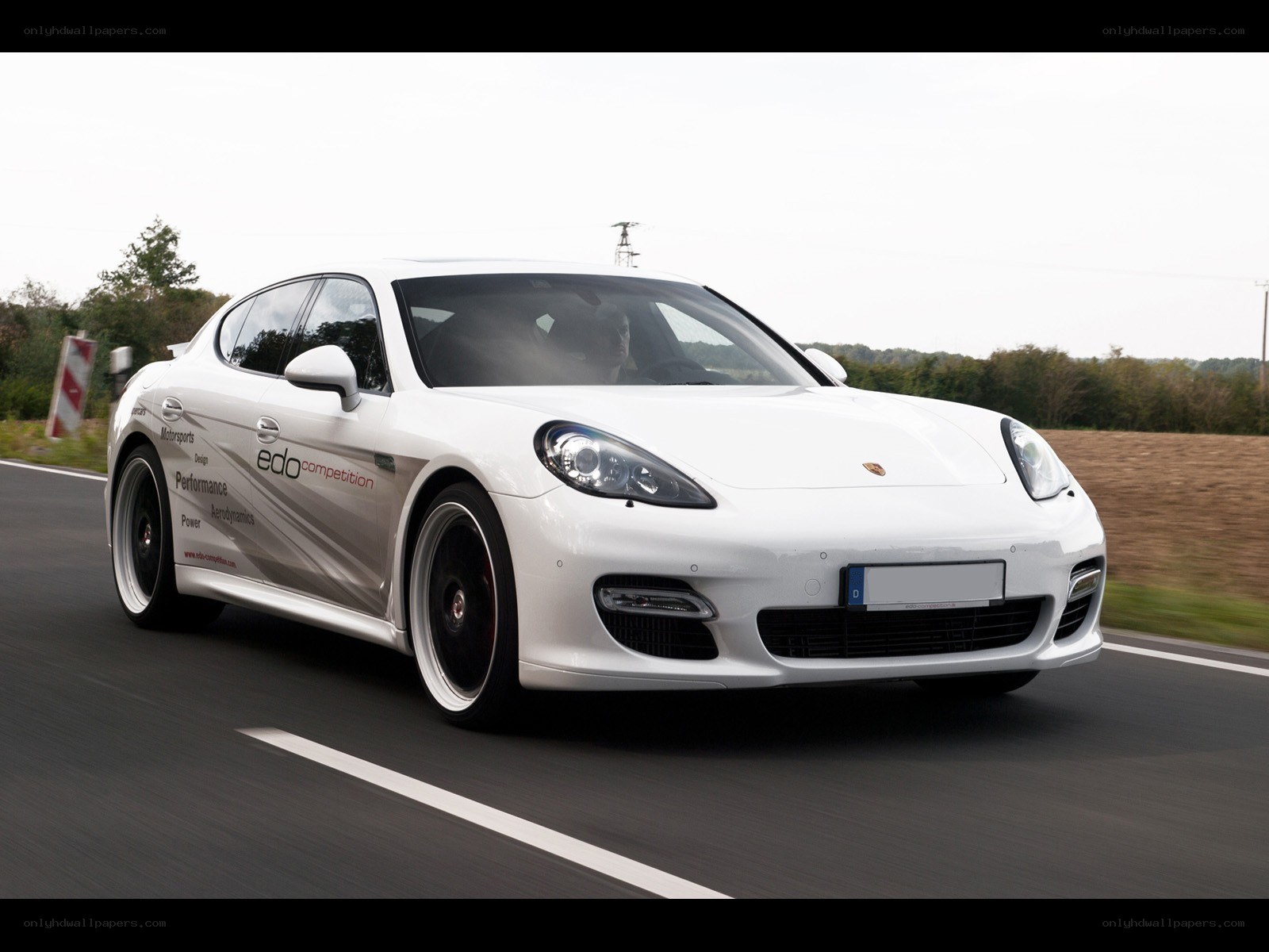 White Porsche Panamera in motion
