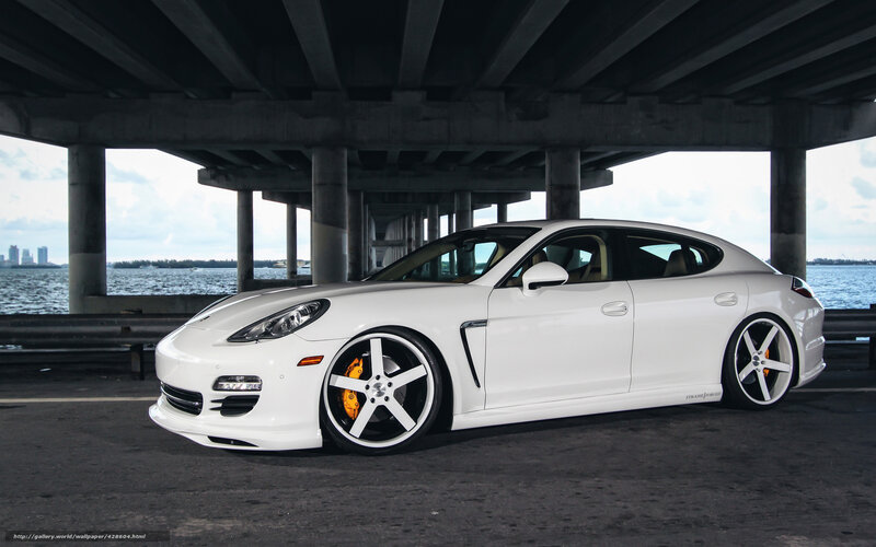 White Porsche Panamera under bridge
