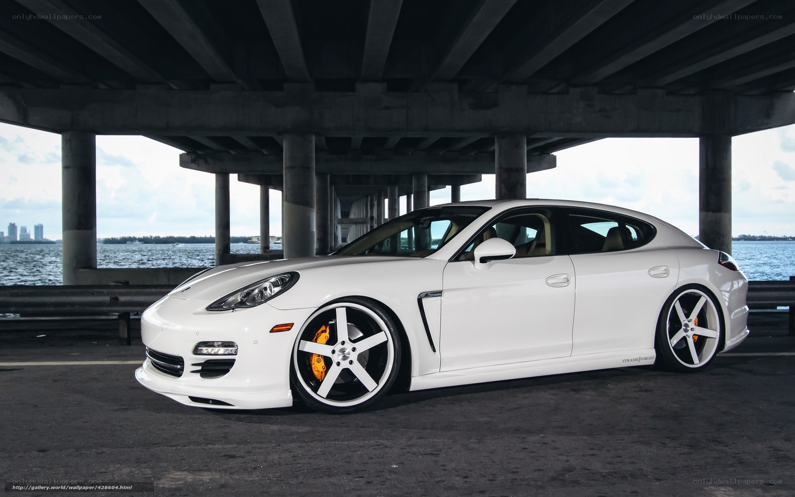 White Porsche Panamera under bridge