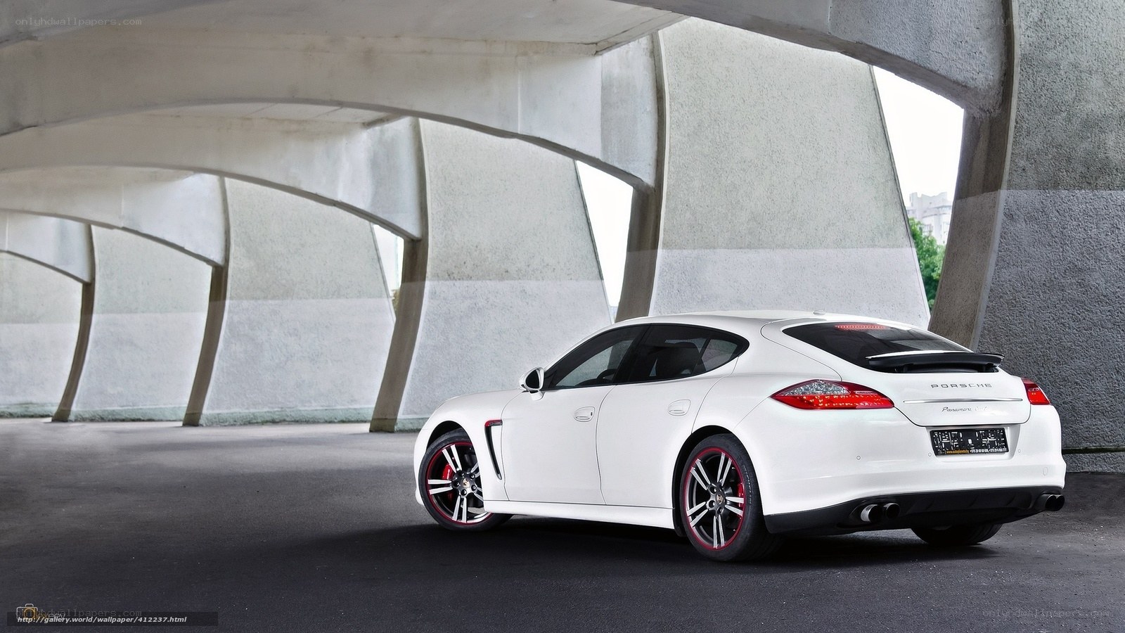 White Porsche Panamera under concrete structure
